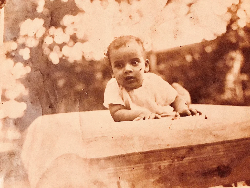 Black-and-white photograph of Dr. Sarvepalli Radhakrishnan as a toddler, sitting and looking towards the camera.