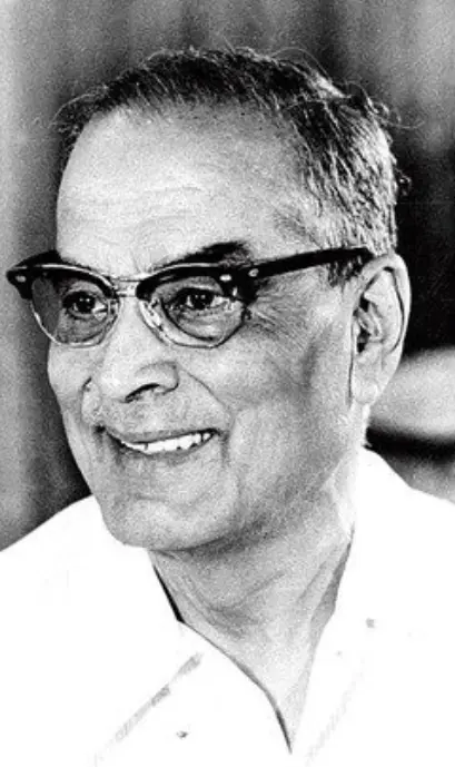 Dr. Bidhan Chandra Roy, shown in formal early‑to‑mid‑20th‑century attire—possibly a suit or traditional Indian dress—facing the camera with a dignified, composed expression.