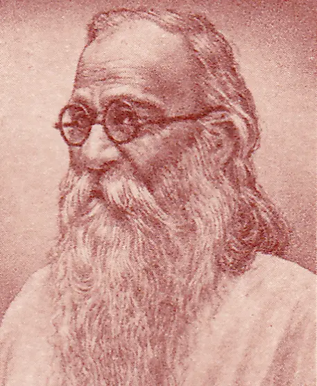 Portrait of an elderly man with long white hair, a flowing beard, and round glasses, wearing traditional attire.