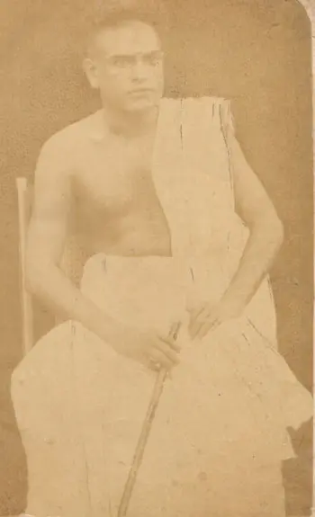 Young C. V. Raman in formal attire, wearing a turban and suit, looking directly at the camera with a confident expression.