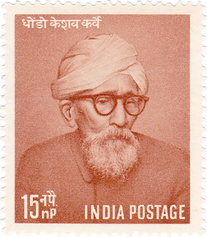 Indian postage stamp featuring Dhondo Keshav Karve, shown wearing a turban, round glasses, and a beard, valued at 15 naya paisa.