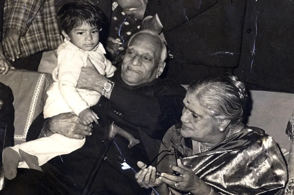 Navin Krishna Giri, great-grandson of former Indian President V. V. Giri, standing beside his great-grandfather in a formal setting.