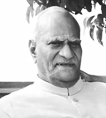 V. V. Giri, the fourth President of India, wearing a white Nehru jacket and traditional Gandhi cap, seated in a formal setting.