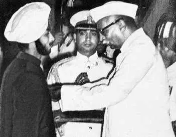 Dr. Rajendra Prasad presenting a Padma Award during a formal ceremony in India.