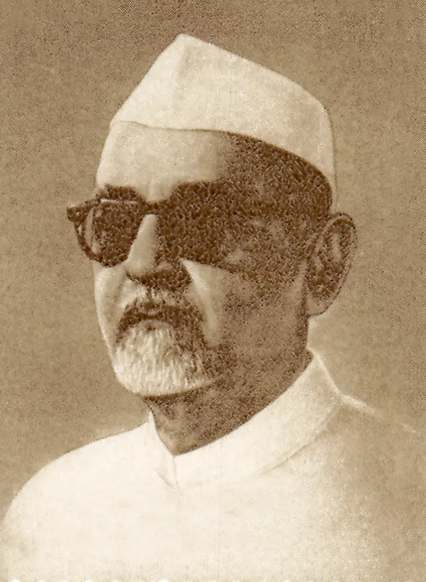Dr. Zakir Husain, President of India, seated and engaged in conversation with an unidentified individual in a formal setting, likely during a state function in 1968.