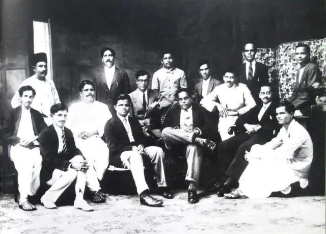 Black-and-white photograph of Dr. Babasaheb Ambedkar seated third from the right in the front row, surrounded by colleagues of the Samaj Samata Sangh in Mumbai, 1927.