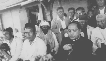Dr. B. R. Ambedkar with Dadasaheb Gaikwad and other social workers, captured during a public event in Maharashtra.