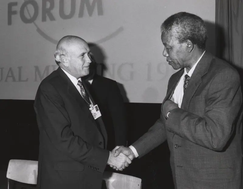 Nelson Mandela shaking hands with Frederik de Klerk at the 1992 World Economic Forum Annual Meeting in Davos.