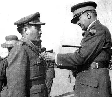 Historic black-and-white photo of an Indian Army officer being decorated, alongside a painted portrait of the officer in uniform.