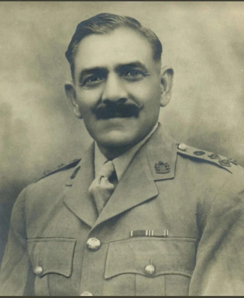 Black-and-white portrait of an Indian Army officer in uniform from the early years after Independence, wearing service ribbons and insignia.