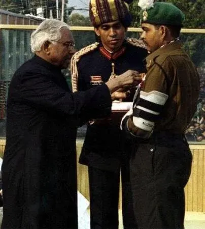 This image shows an Indian Army serviceman receiving a distinguished military award from a senior dignitary during an official ceremony. The photograph captures a moment of honor, valor, and national recognition. It’s ideal for blog posts about gallantry awards, military achievements, national pride, defense heroes, and inspirational moments from armed forces history.
