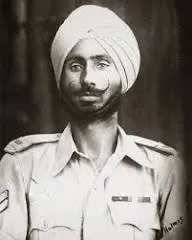 Black and white portrait of an Indian Army soldier wearing a turban and uniform.