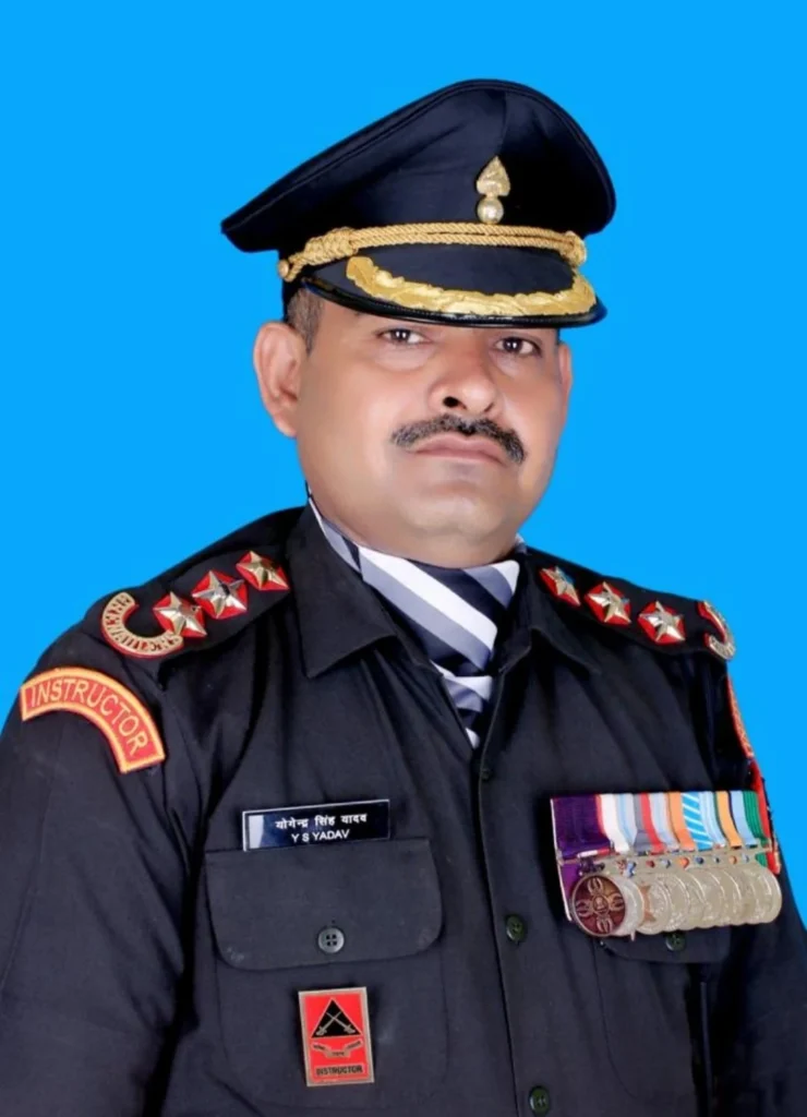 This image shows an Indian Army serviceman in uniform holding and displaying a high military honor medal. The photograph reflects bravery, dedication, and recognition of courageous service. It can be used to illustrate themes of military valor, national pride, and the sacrifices made by armed forces personnel.