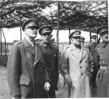 Historic black-and-white photograph of military officers inspecting troops during the Second World War era